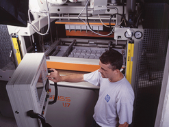 Utz employee operating thermoforming machine