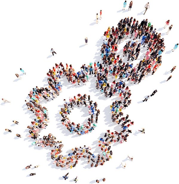 Drone photo of many people who together form two cogs that mesh