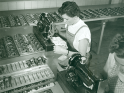 Old photo of Utz employee working on a tool